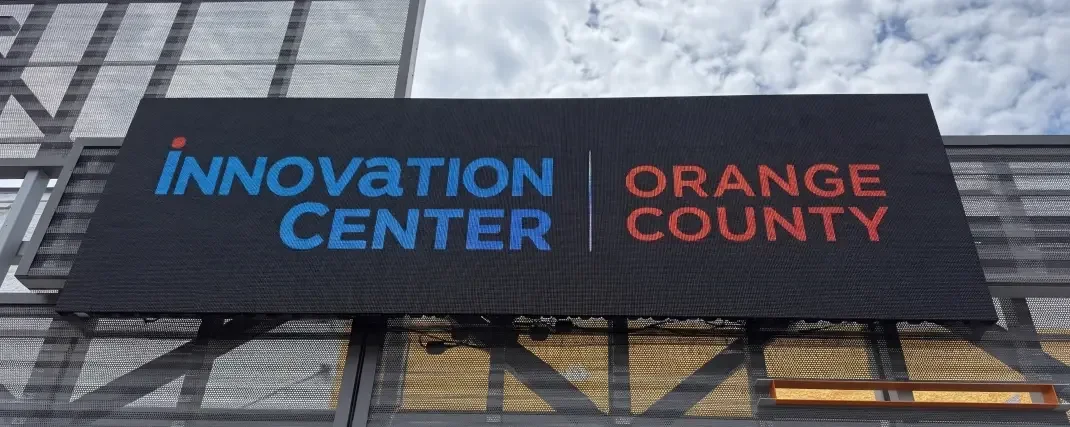 Wide full-color LED display mounted on a building facade