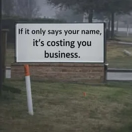 Blank changeable-letter monument sign on a busy road