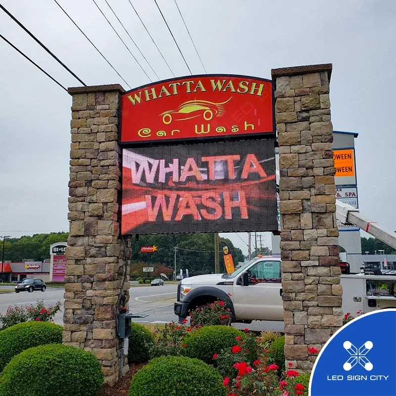 Whatta Wash car wash LED sign on stone columns